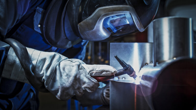 Welder working in factory
